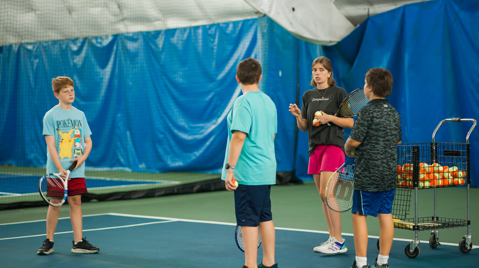 A junior group session with a coach at Match Point KC